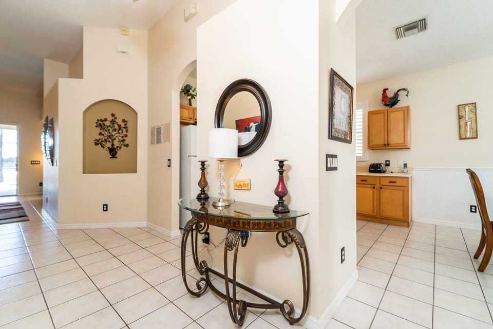 Entryway that leads into the kitchen and living room.