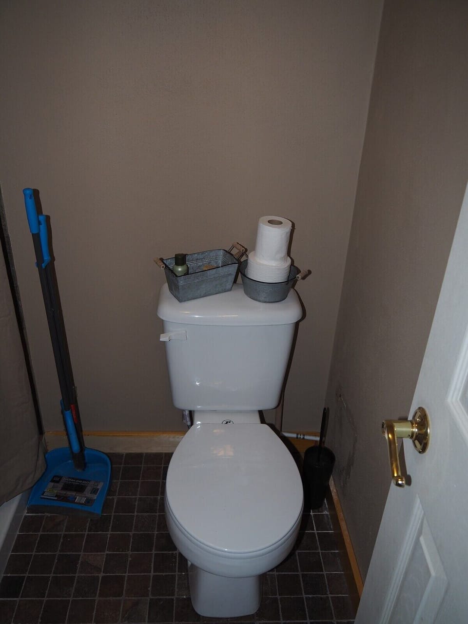 BATHROOM:  Features a shower and toilet.  (Note that there is no vanity, sink, or mirror in the bathroom.)