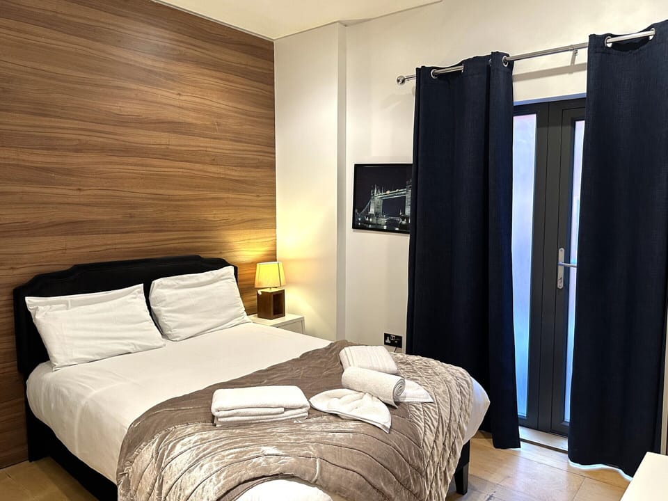 A double room with private bathroom and balcony, featuring a standard double bed for comfort.