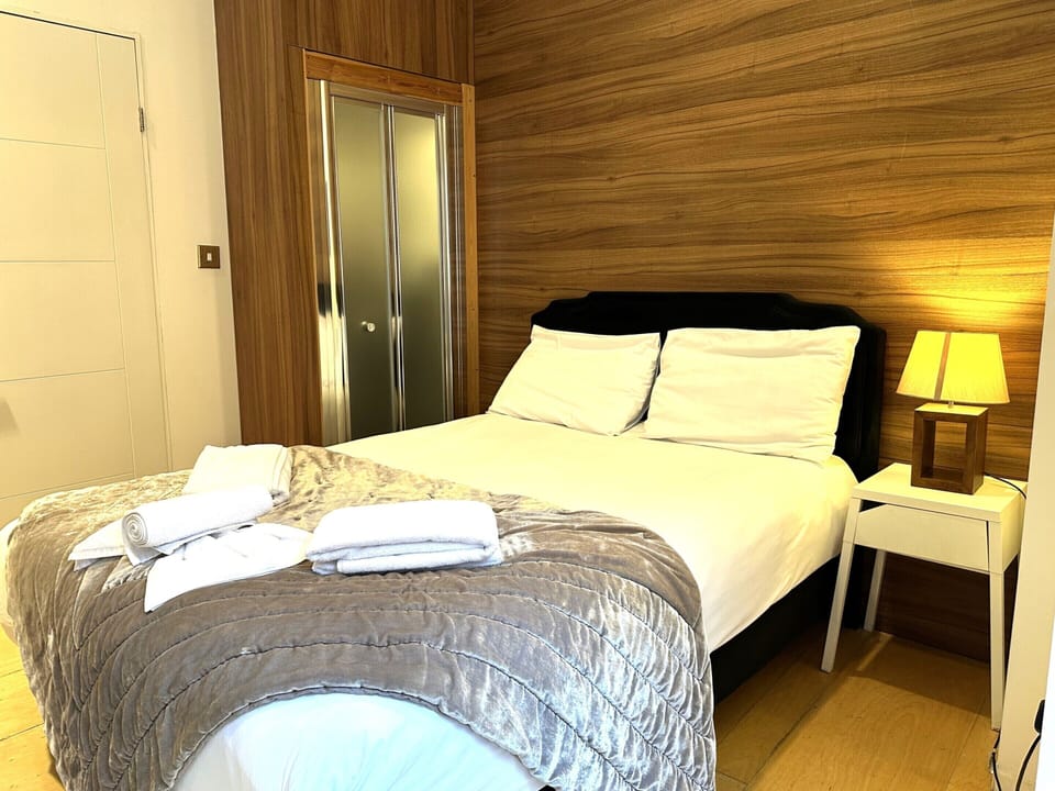 A double room with private bathroom and balcony, featuring a standard double bed for comfort.