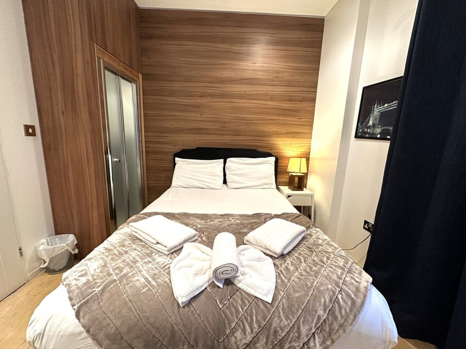 A double room with private bathroom and balcony, featuring a standard double bed for comfort.