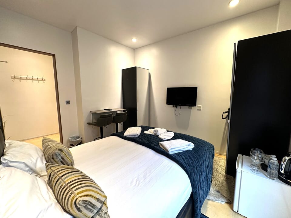 A double room with private bathroom and balcony, featuring a standard double bed for comfort.
