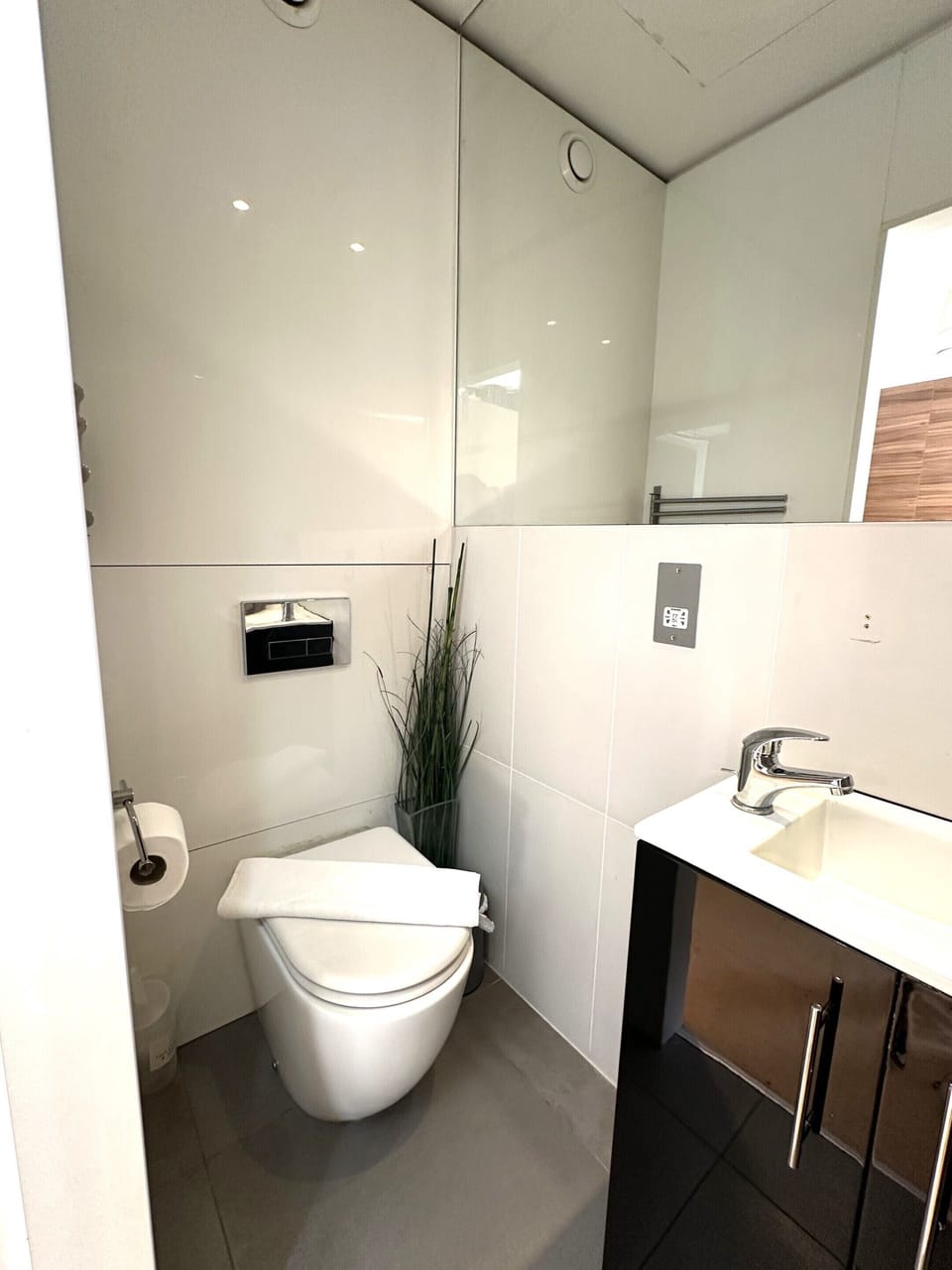 standard toilet with shower, shampoo, conditioner, hand wash, and toilet paper for your convenience.