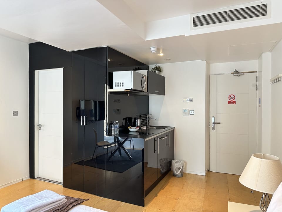 A studio featuring a private bathroom, kitchen, balcony, and a comfortable room for your stay.