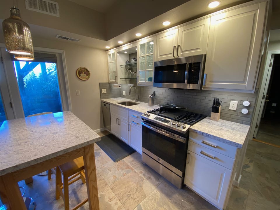 Kitchen with gas stove, dishwasher, microwave, large fridge (not in frame)