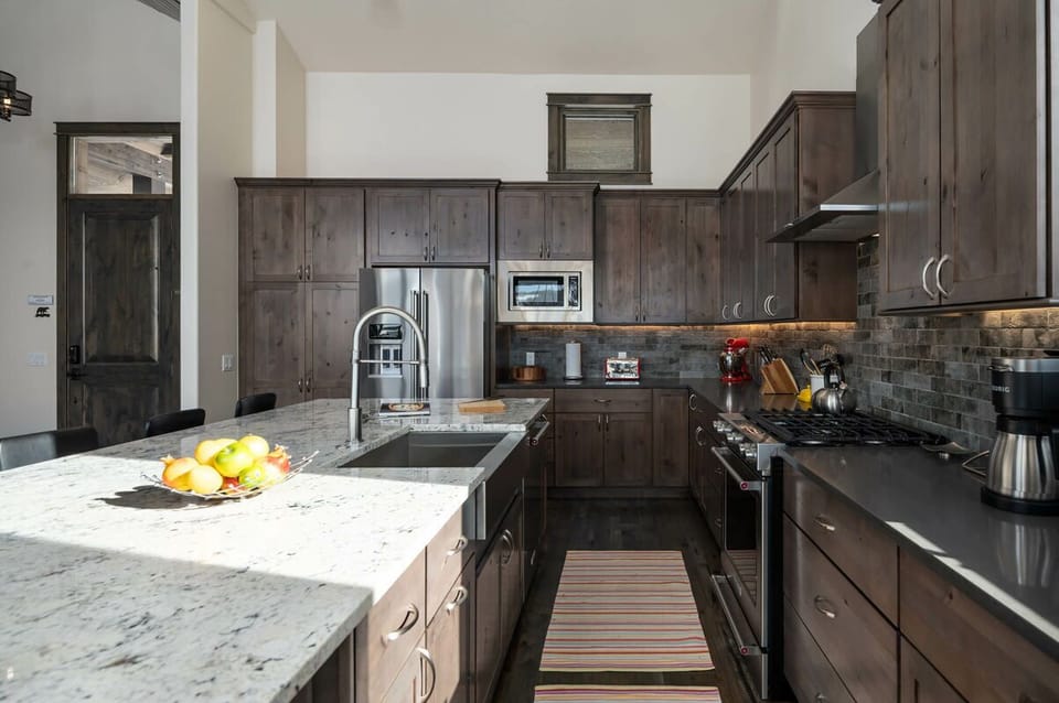 The kitchen hosts all new appliances, perfect for the chef in your group