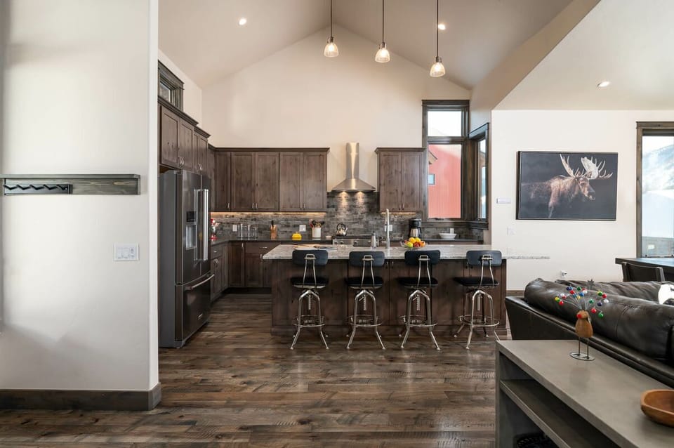 The living room leads into the gourmet kitchen