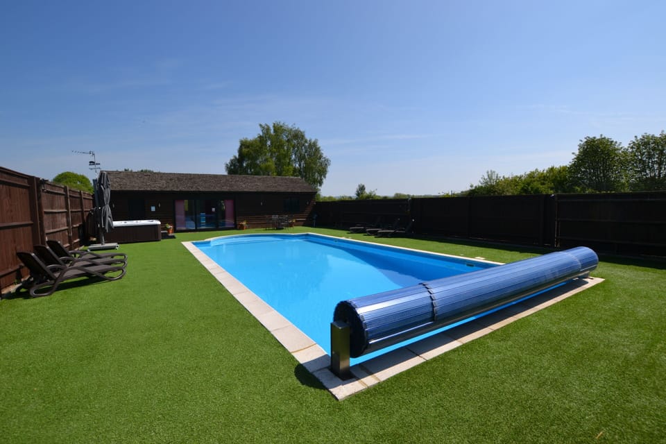 Fully enclosed and secluded garden with pool and hot tub (Exclusive to The Pool House)