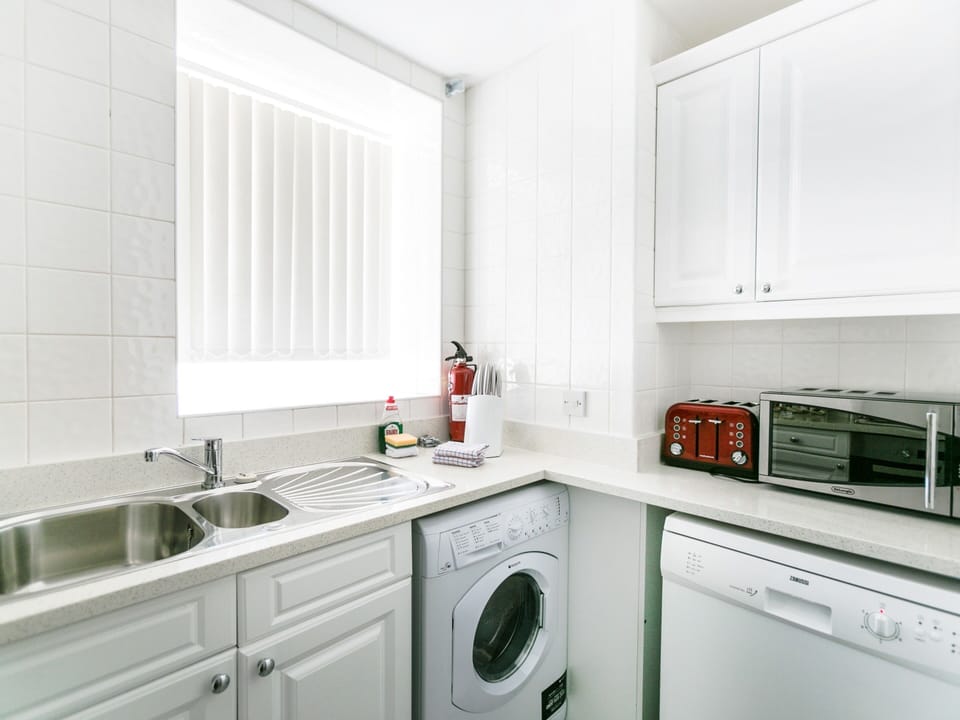 Modern kitchen with all appliances and cookware