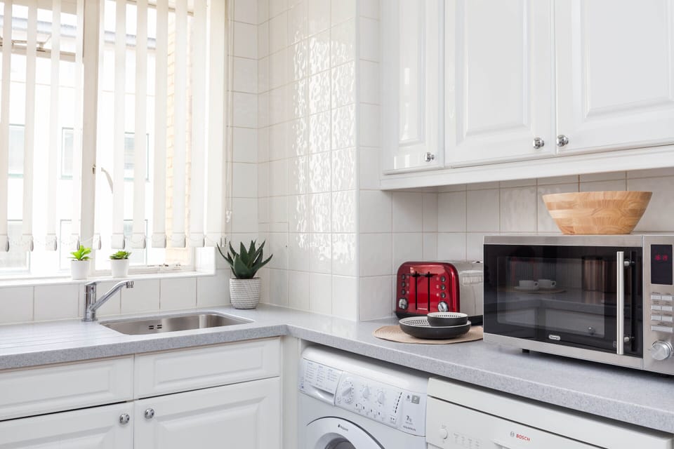 Modern kitchen with all appliances and cookware
