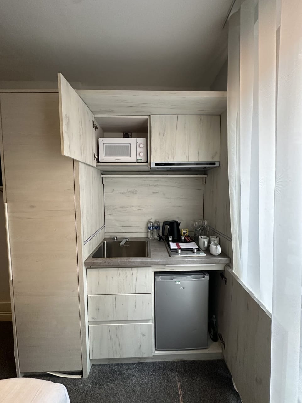 Stove, microwave, mini fridge, tea and coffee making facilities, glassware, private kitchen, plates, and more.