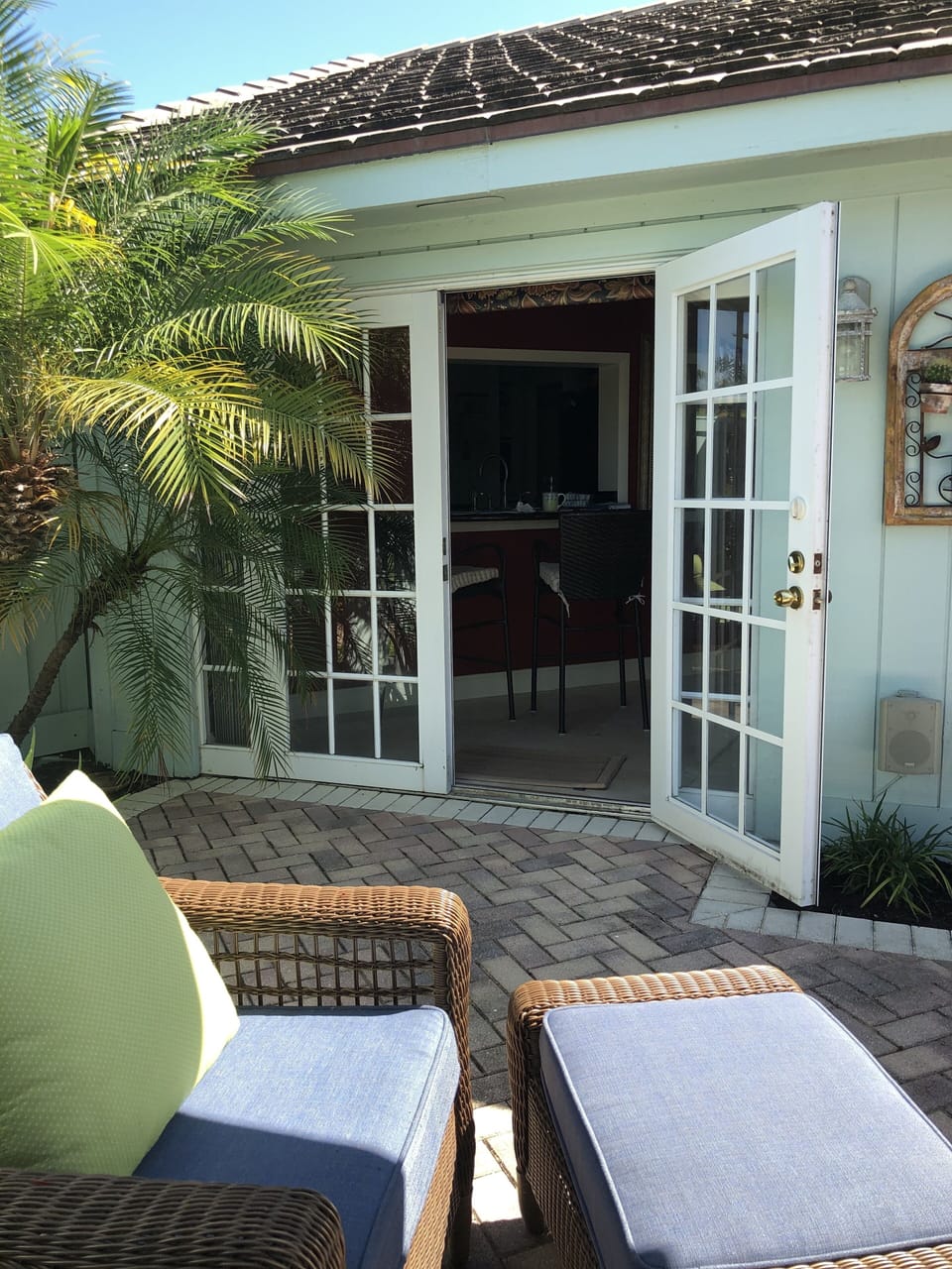 French doors to private patio with Weber grill, firepit, & Bluetooth speakers. 