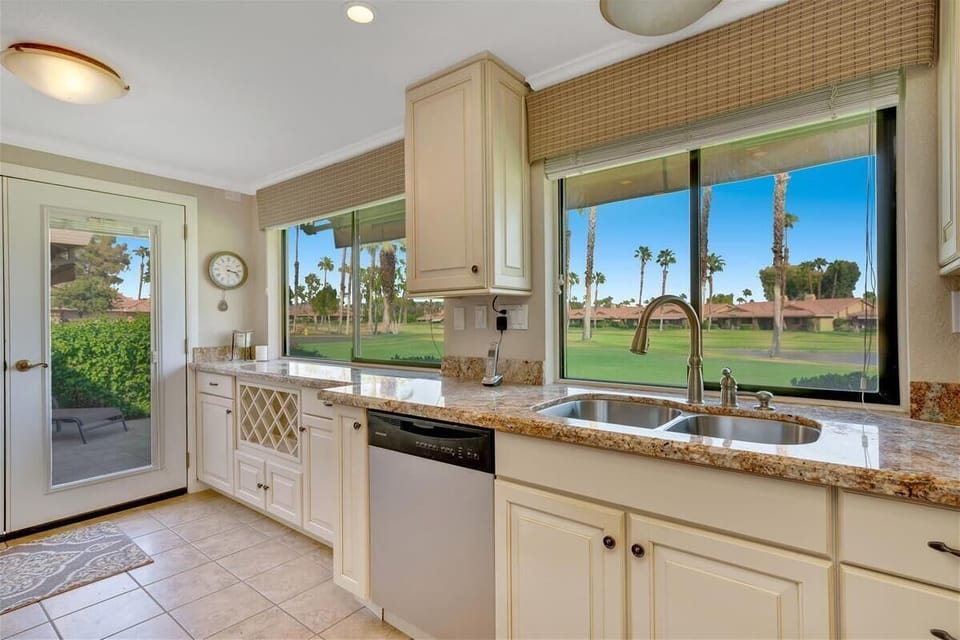 Kitchen overlooking golf course and fountain.