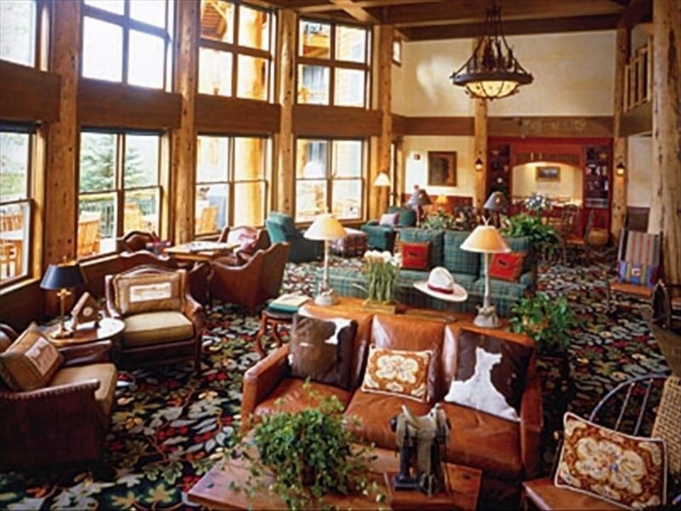 Inviting great room/lounge with huge woodburning fireplace.