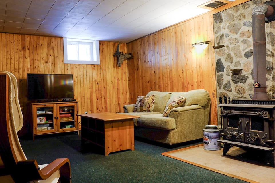 Lower floor den, with TV room and wood burning stove