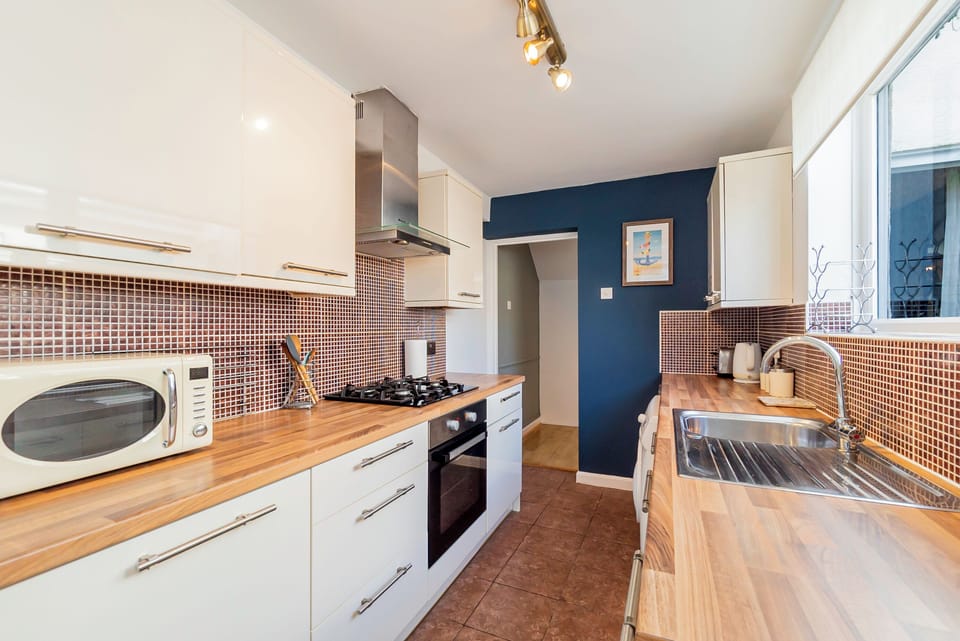 Kitchen Delight: Modern design meets functionality with a sleek layout and vibrant accents!