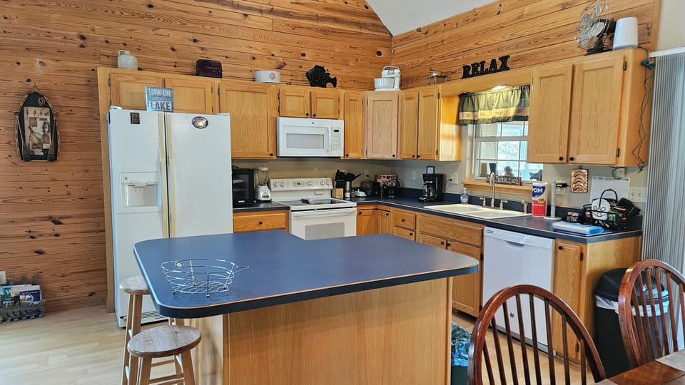 Well equipped kitchen.  Seating at table for 6 plus a highchair.  