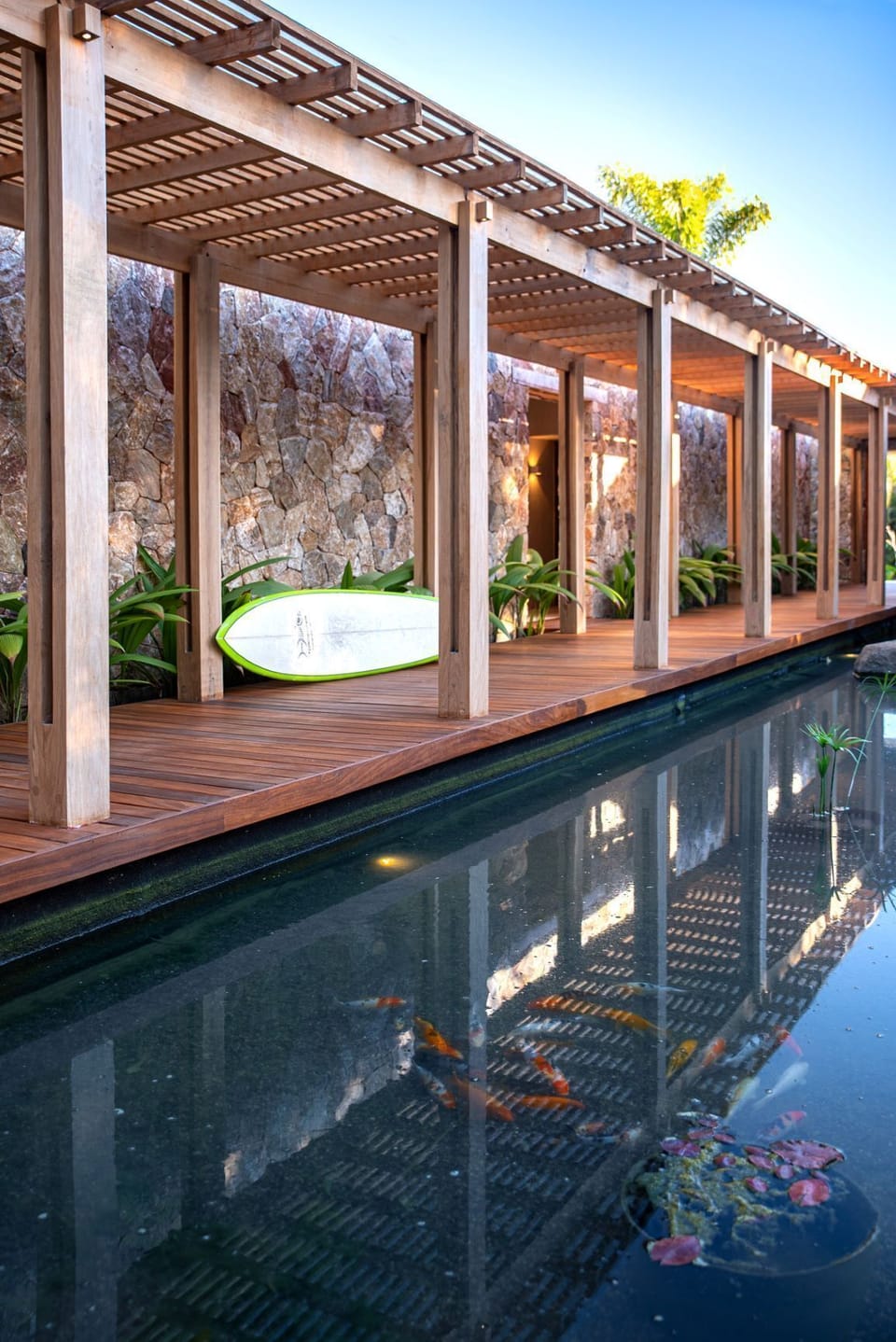 Main covered trellis walkway into the villa along the lagoon.