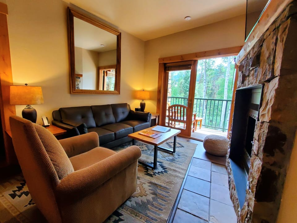 Living Room with gas fireplace and balcony