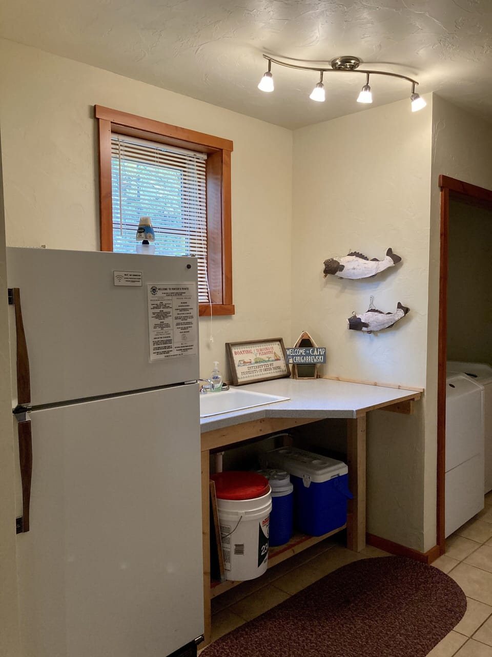 Additional fridge downstairs with sink.