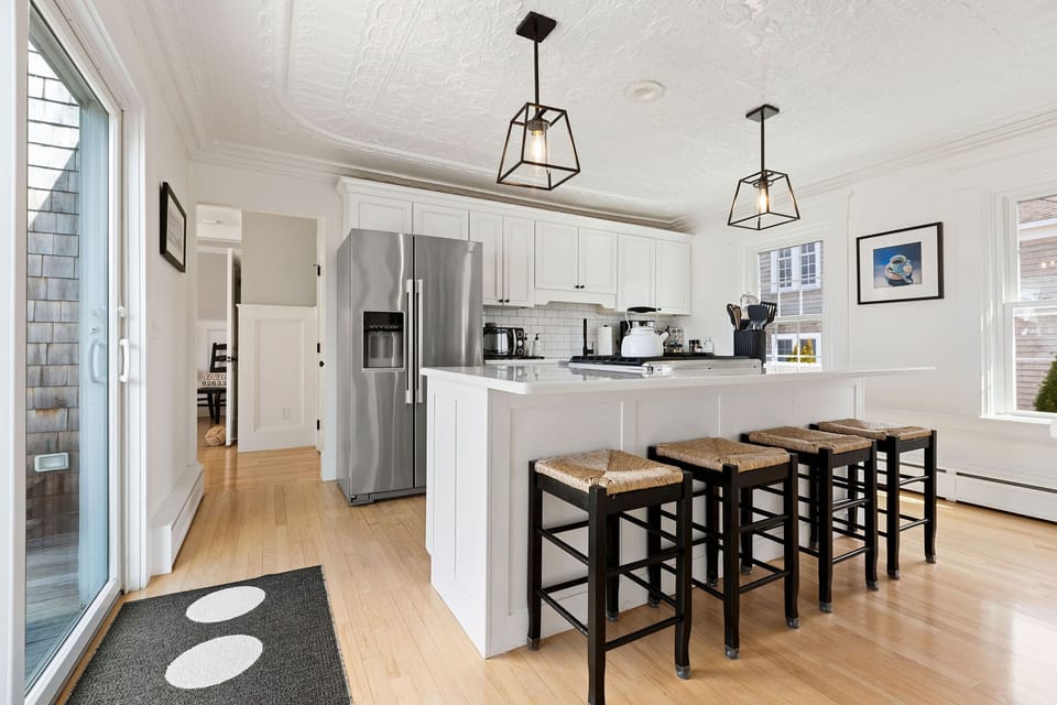 Beautiful and bright kitchen with pastel painting from local Chatham artist. 