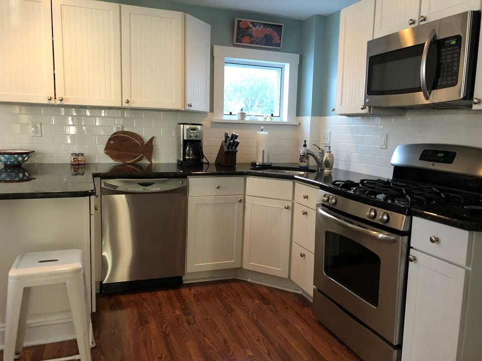 Updated kitchen with stainless appliances and breakfast bar