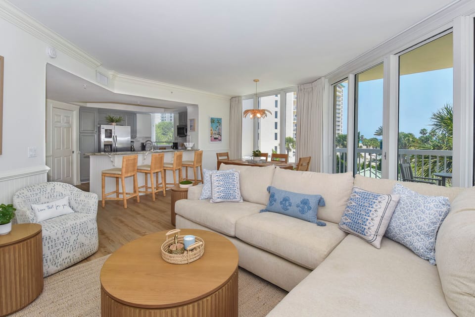 Unwind in your bright, coastal living space with soft textures, palm views, and breezy balcony access. Perfect for lazy mornings and sunset cocktails.