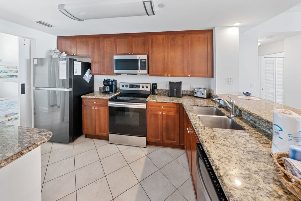 Step into your fully equipped kitchen with granite countertops, stainless steel appliances, and everything you need to create memorable meals during your stay.