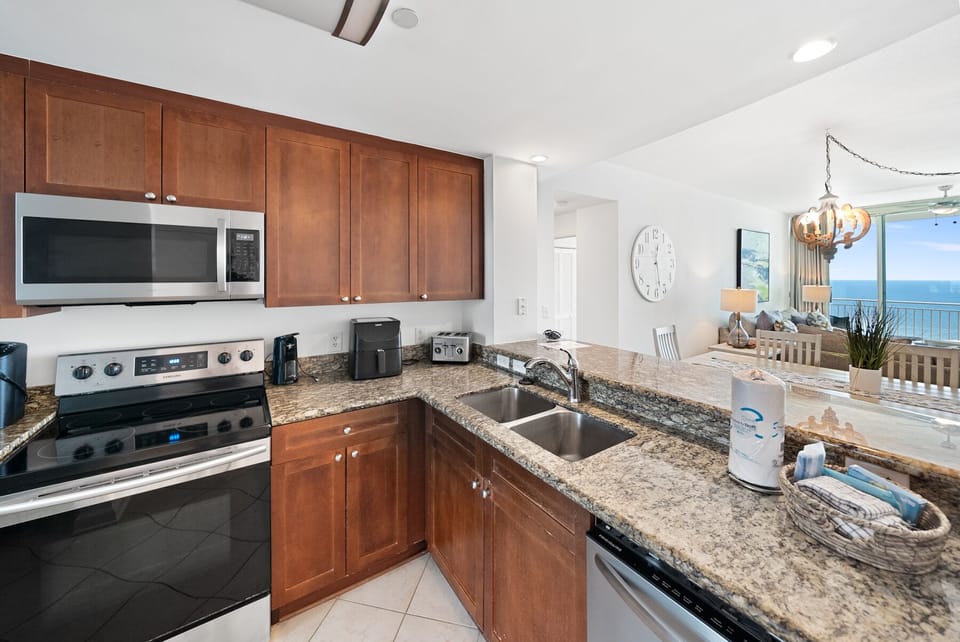 Your fully equipped kitchen features granite countertops, stainless steel appliances, and stunning ocean views while you prepare your favorite meals.