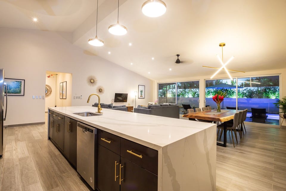 Kitchen + Living + Dining Room at dusk.