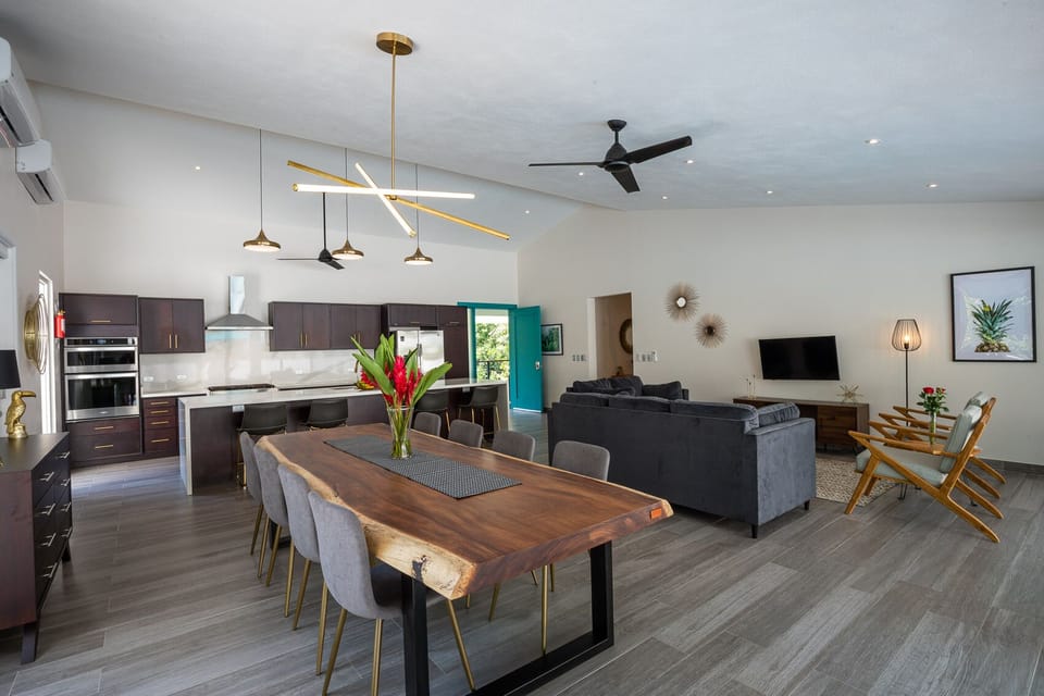 Kitchen + Living + Dining Room with large live edge Guanacaste Table.