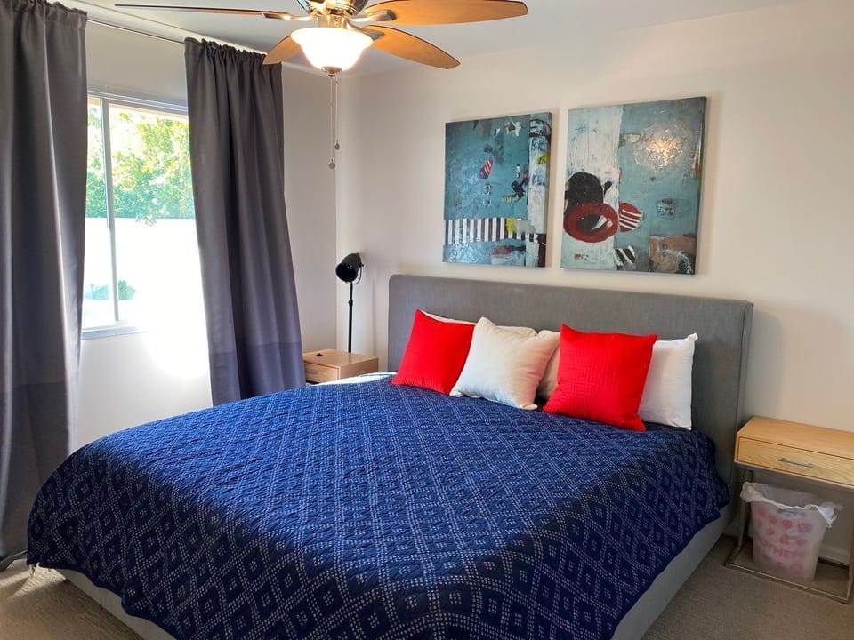 second bedroom with king bed.  Window looks out to pool