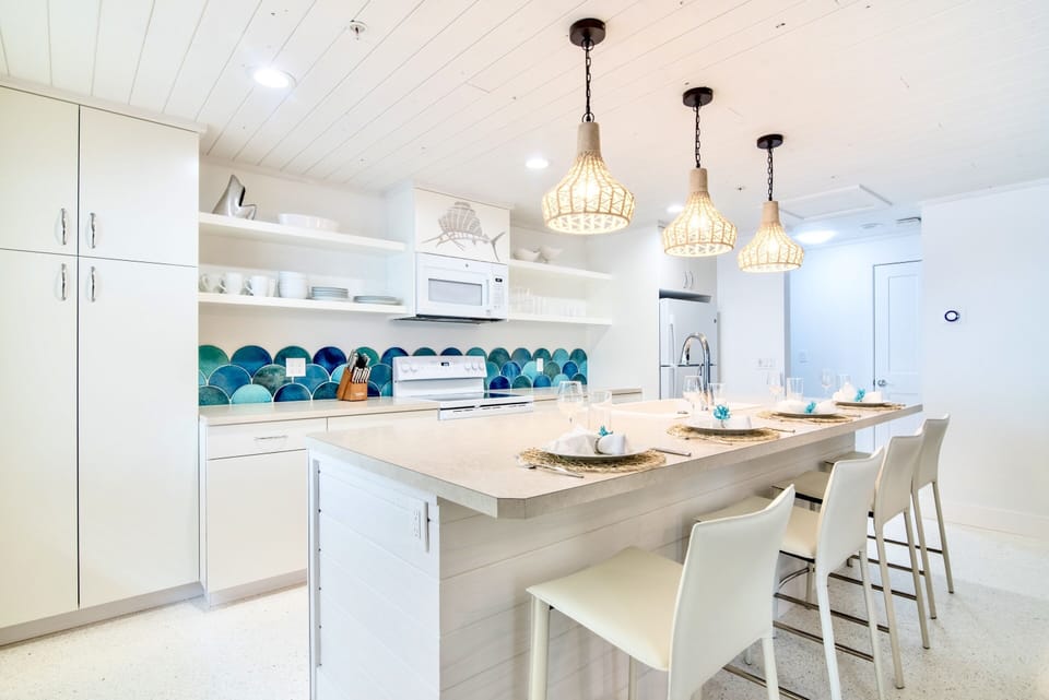 Oversized island bar for dining in open floor plan