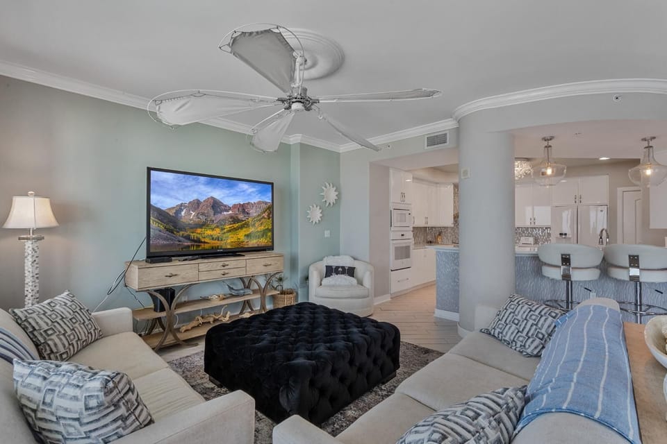 Spacious living room with cozy seating and scenic TV views