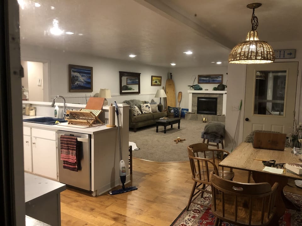 Cozy upstairs living room & kitchen- with windows on entire south side!