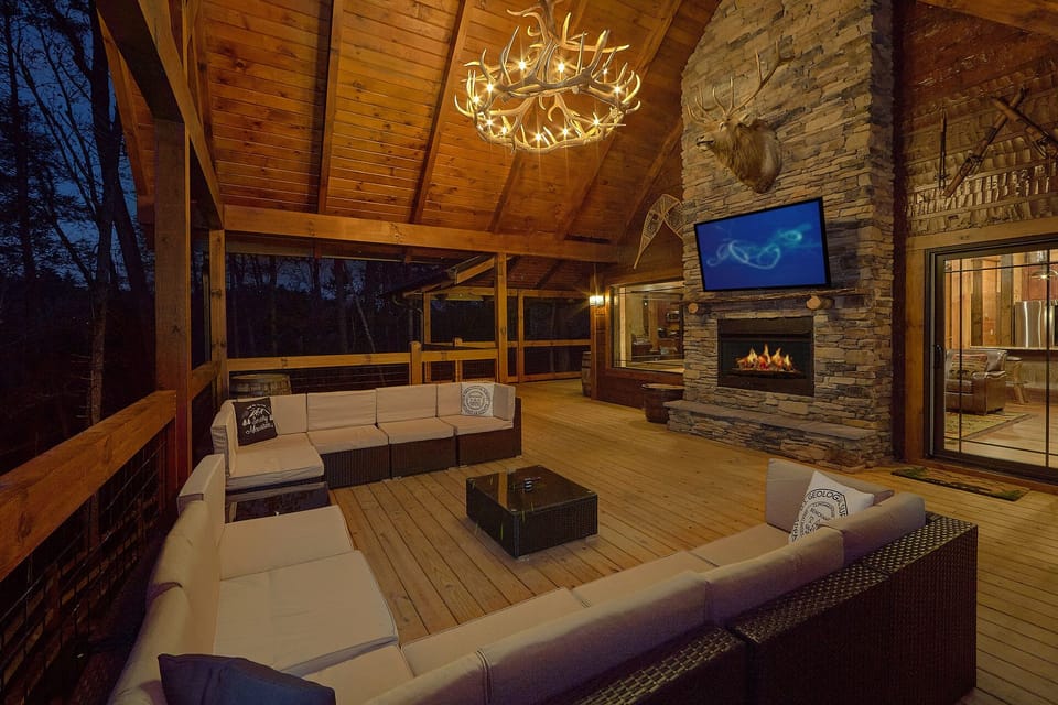 Outdoor living area with fireplace and TV