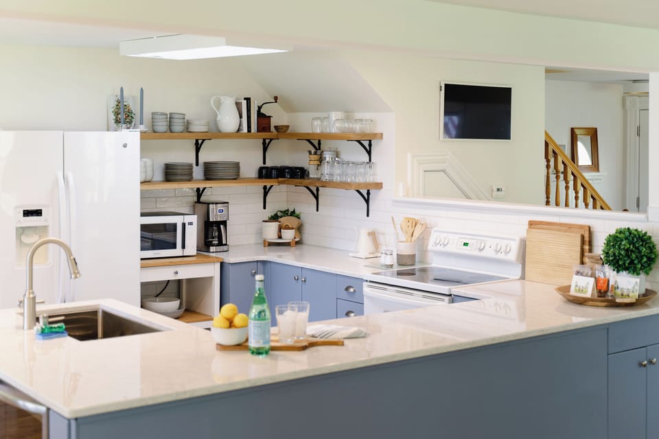 A large kitchen has everything a cook will need including a lobster pot