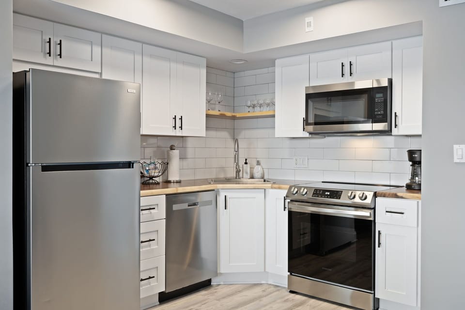 Expansive living room with full kitchen overlooking marina