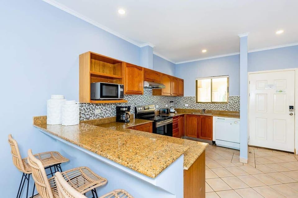 Fully stocked kitchen with breakfast bar