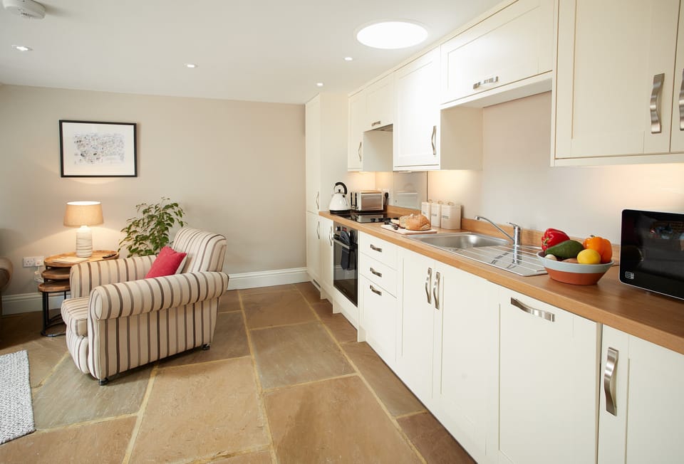 Ground floor: Kitchen with open plan dining area and sitting room