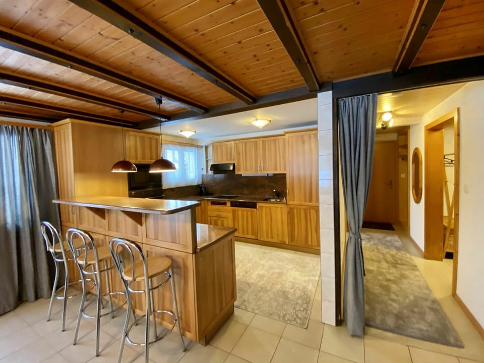 Furniture, Countertop, Wood, Cabinetry, Table, Building, Kitchen Appliance, Wood Stain, Kitchen, Chair