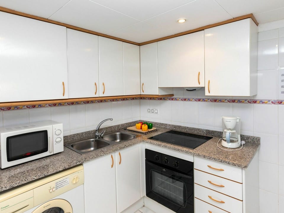 Countertop, Cabinetry, Property, Kitchen Appliance, Kitchen Stove, Cooktop, Home Appliance, Kitchen, Gas Stove, Sink