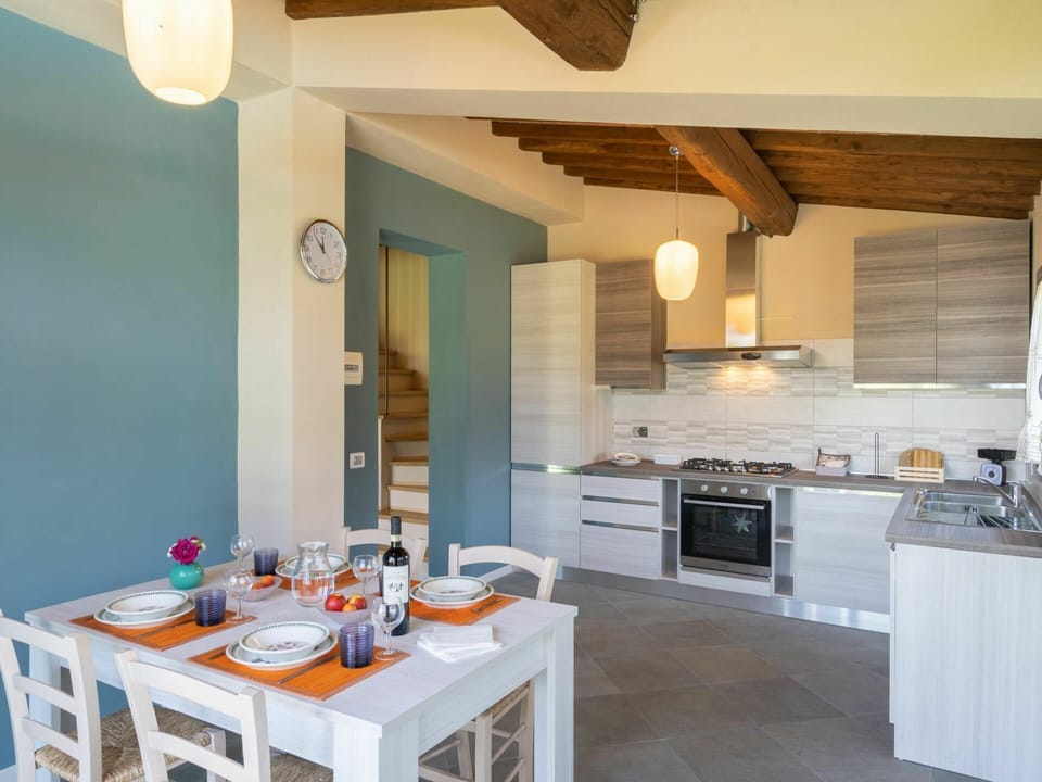 Countertop, Cabinetry, Property, Furniture, Table, Wood, Kitchen, Interior Design, Lighting, Architecture