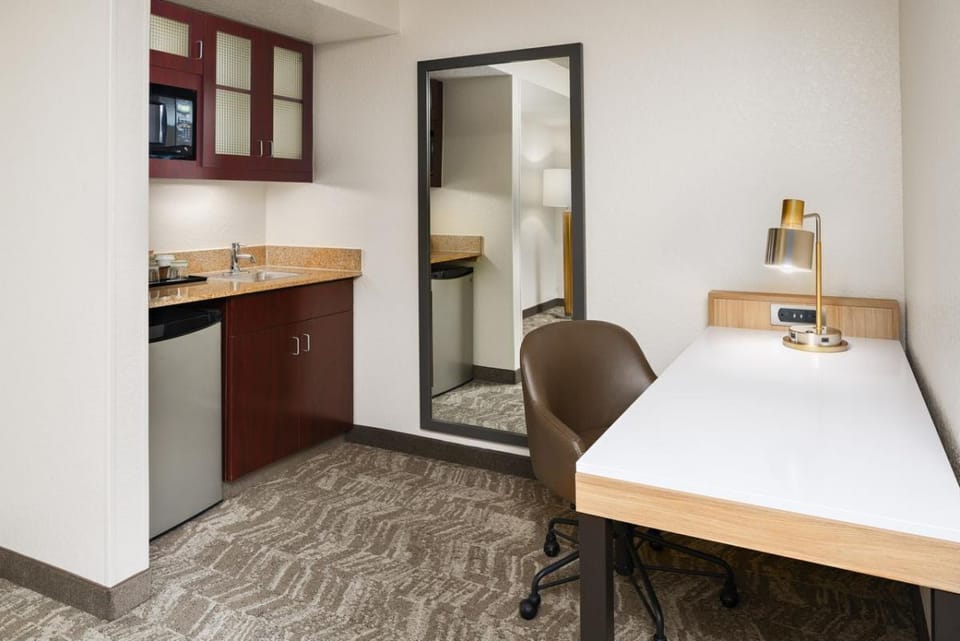 Settle in with a handy kitchenette and focused work desk.