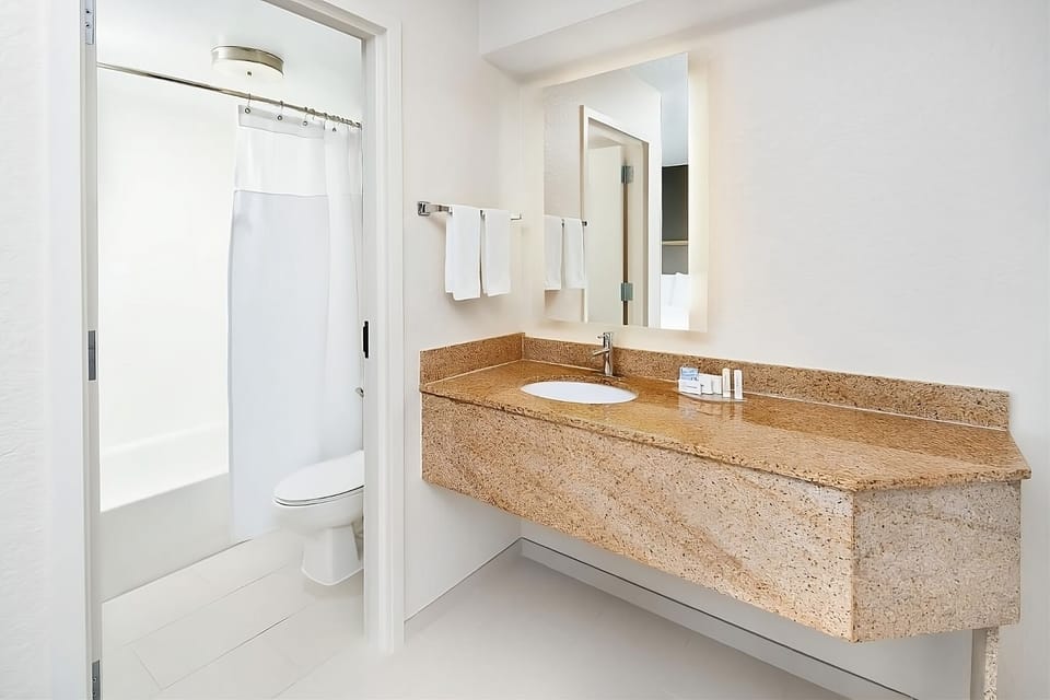 Refresh easily in a spotless bath with generous vanity space.