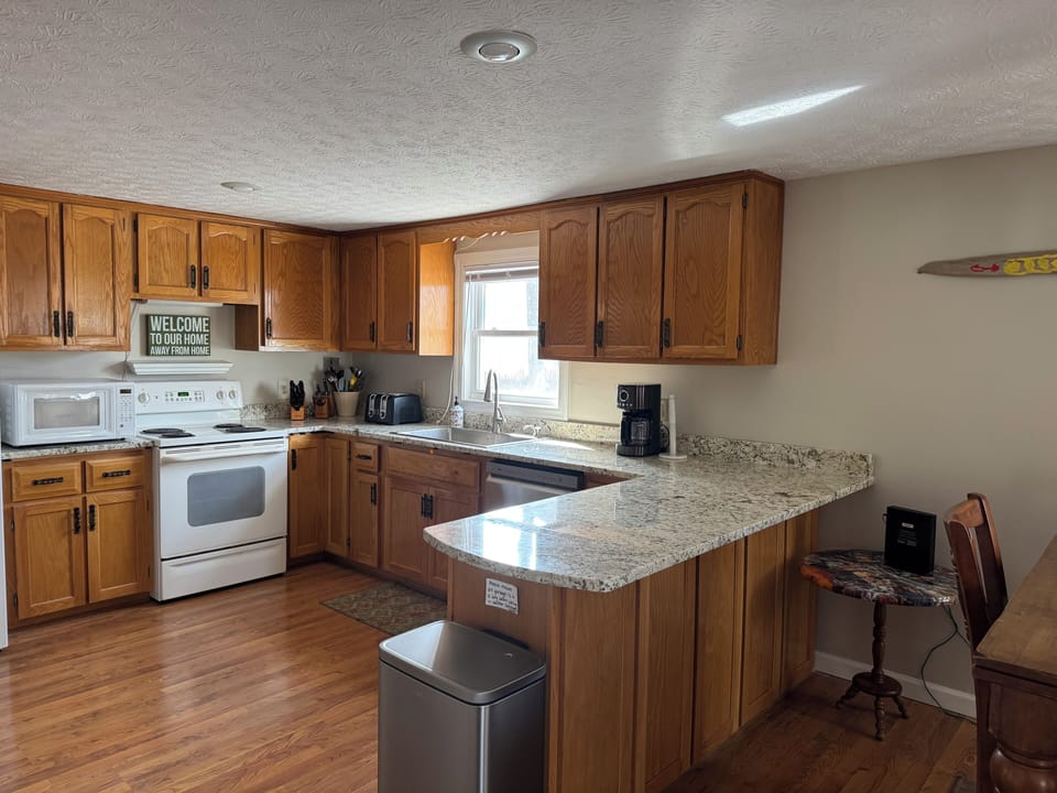 The open kitchen with granite countertops is great for entertaining