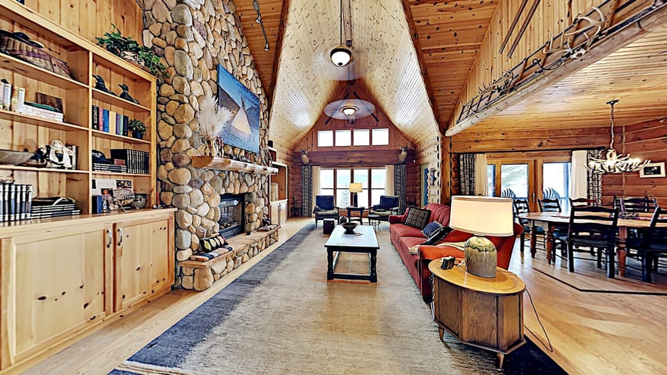 Enjoy views of beautiful long lake from this comfy livingroom