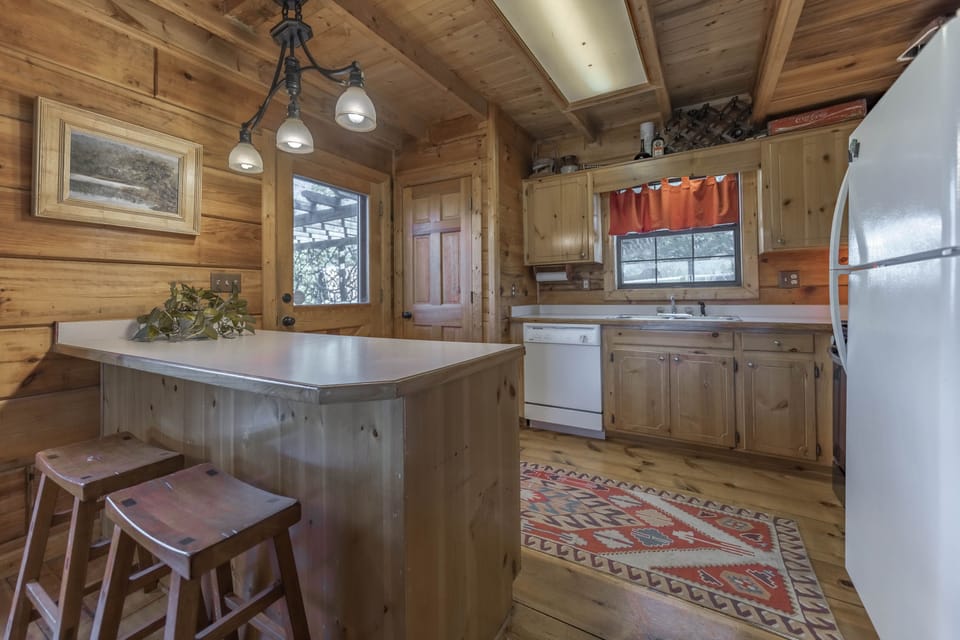 Fully-stocked kitchen with gas stove, dishwasher and microwave 