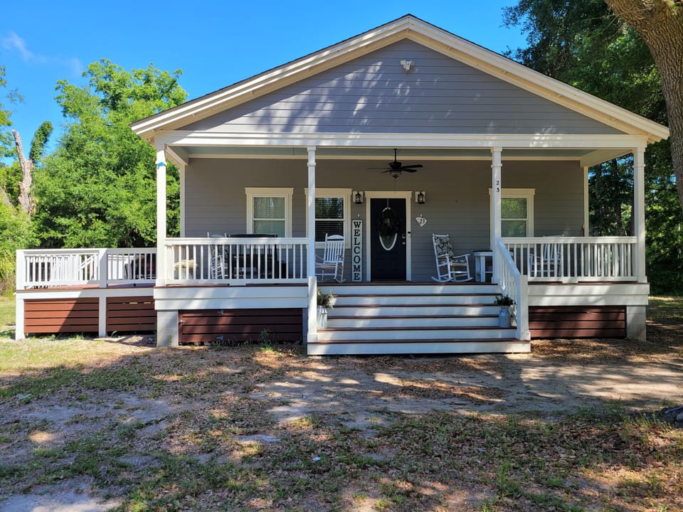 Beautiful large front porch w/lots of seating for the entire family 