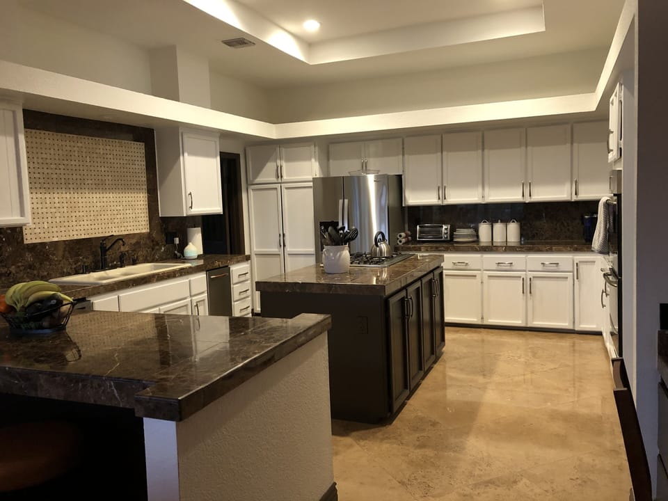 Fully stocked kitchen, 5 gas burner stove, kitchen island, dishwasher, ice-maker